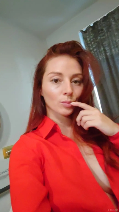 Seductive redhead flaunts huge tits on camera - Amateur explicit photo