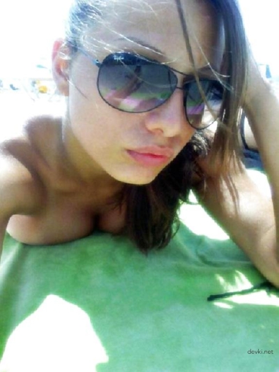 Hot Beach Babe Sunbathing - Amateur Photo of Girl Tanning