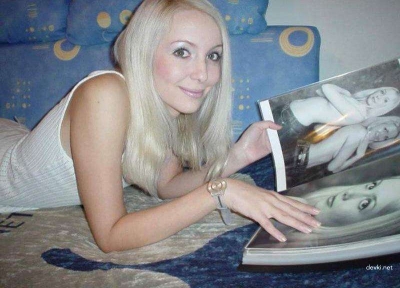 Blonde babe uses sex toy for pleasure in amateur porn pic